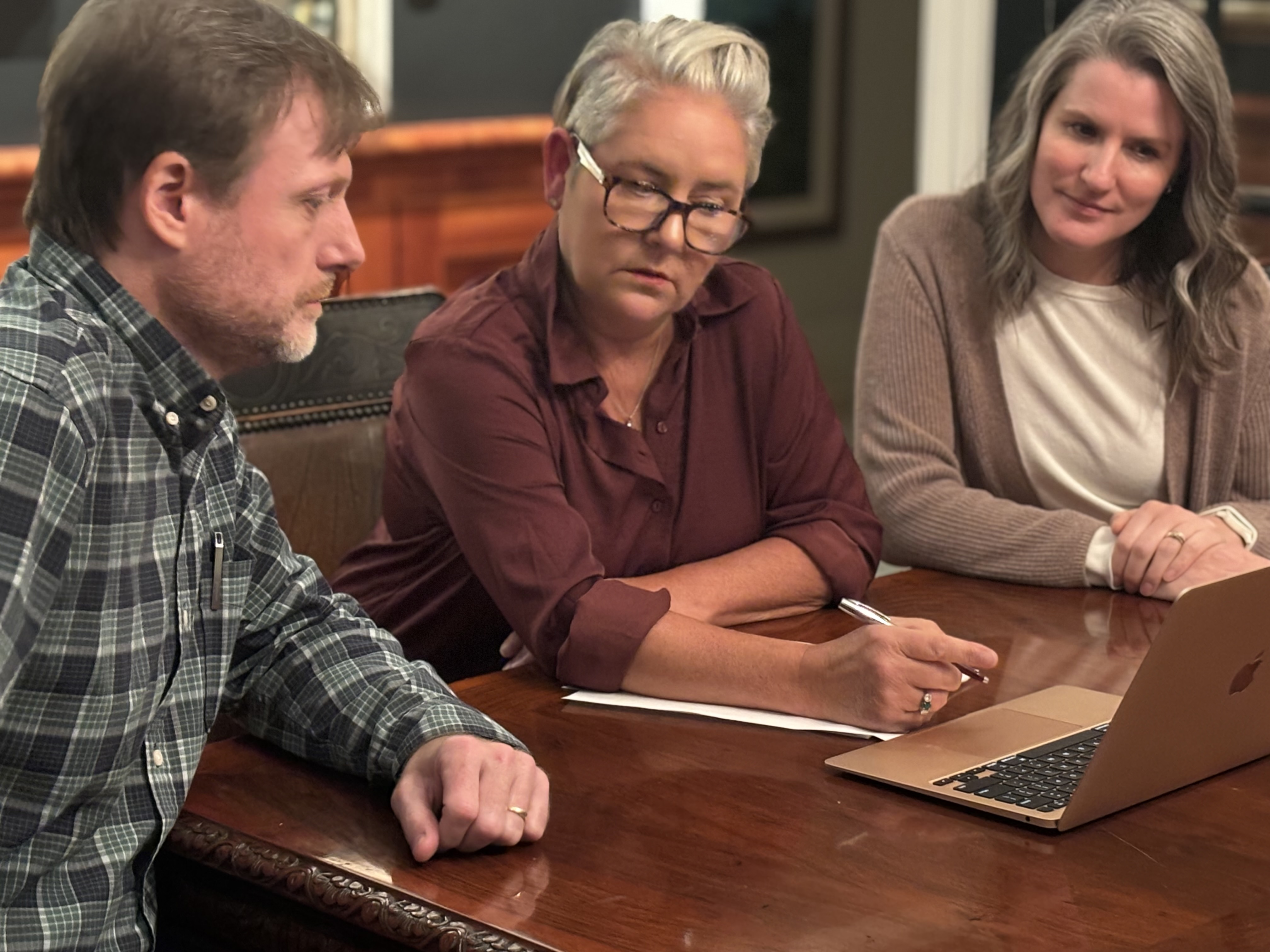 Pictou County Christmas Fund members Jeff Nauffts, treasurer, left, Monique Sobey, centre, chair, and Tiffany Green review plans for this year’s telethon which will mark the 50th anniversary of the event. The show is scheduled for Sunday, Nov. 24, at the deCoste centre.